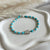 B0283 Bracciale con pepite, palline in pasta di turchese e conchiglia al centro