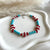 B0282 Bracciale con rondelle in aulite, corallo e perle e argento