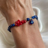 B0288 Bracciale con cubetti di lapislazzuli sfaccettati, corallo e occhio turco portafortuna