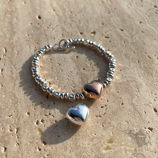 B117 Bracciale con cuore bomby rosato, argentato o dorato al centro, pepite e rondelle