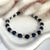 B006 Bracciale con palline occhio di tigre blu e granelli