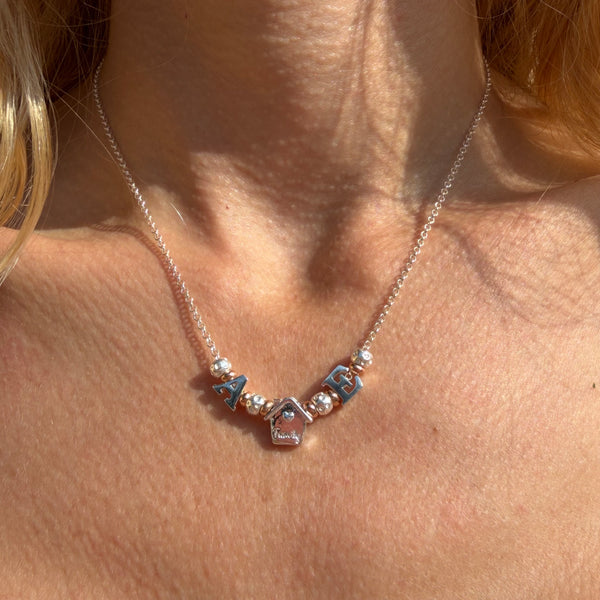 CL125 Collana rolò in argento con iniziali e casina Family passante