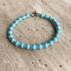 B093 Bracciale con palline turchesi e anelline