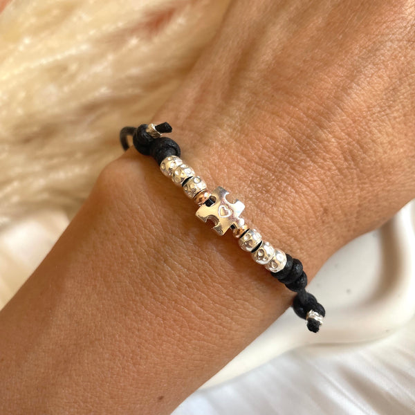 B0241 Bracciale in cordino cerato con puzzle e granelli