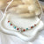CL085 Collana di perle di fiume con stella marina, rondelle corallo e turchese.
