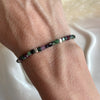 B164 Bracciale in rubino zoisite e rondelle martellate in argento