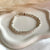 B0303 Bracciale con rondelle irregolari martellate piccole martellate