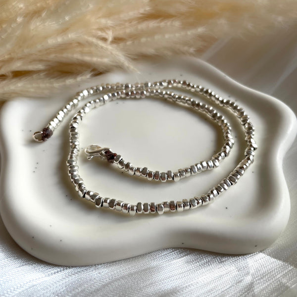 CL0195 Collana argento rondelle irregolari lisce