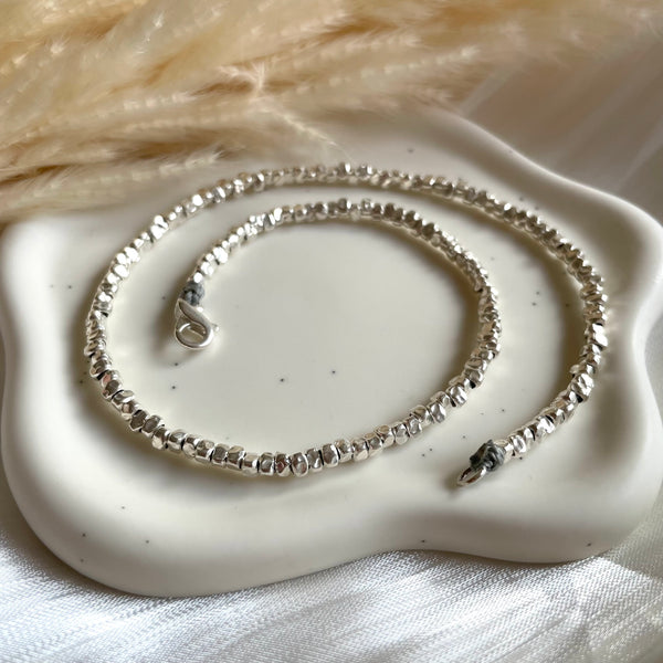 CL0194 Collana argento rondelle irregolari martellate