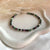 B164 Bracciale in rubino zoisite e rondelle martellate in argento