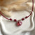 CL0157 Collana con cordino cerato granelli nuovi e cuore in vetro di murano rosso