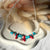 CL102 Collana estate con perle di fiume, chips di turchese, corallo e argento