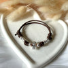 B146 Bracelet with children's loop elements, waxed cord with new grains