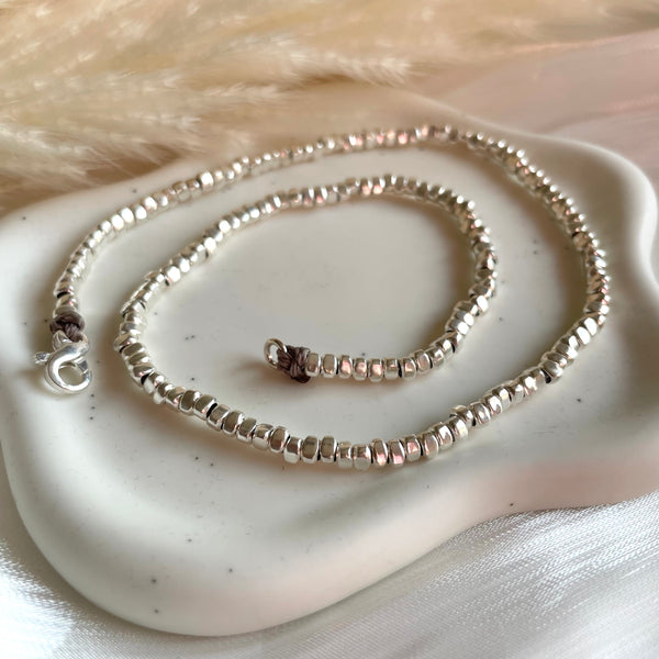 CL0195 Collana argento rondelle irregolari lisce