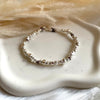 B0304 Bracciale con rondelle irregolari piccole e grandi e mix di pepite