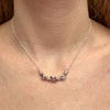 CL0159 Collana rolò in argento con rondelle, iniziali cubo e puzzle passante