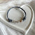 B143 DAD bracelet waxed cord and new grains + pink heart loop