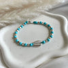 B0283 Bracciale con pepite, palline in pasta di turchese e conchiglia al centro