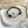 B0241 Bracciale in cordino cerato con puzzle e granelli