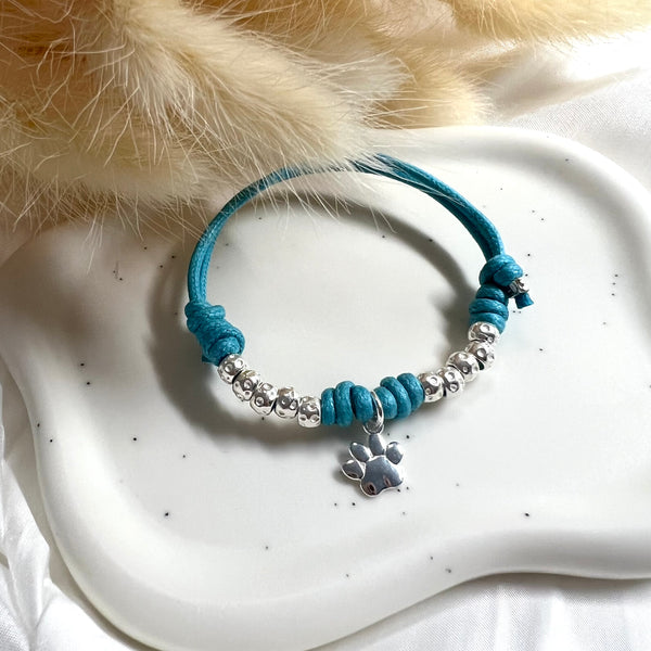 B119 Bracciale con 4 nodi di cordino cerato, 10 granelli nuovi, + ciondolo a scelta (a parte)