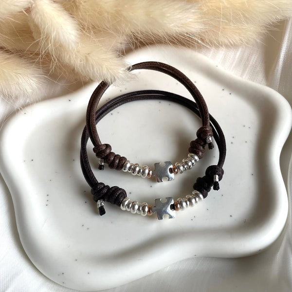 B0244 Bracciale in cordino cerato con puzzle e rondelle