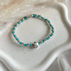 B0280 Bracciale con nodi, palline e fiore passante “grazie maestra”