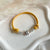 B0278 Bracciale in cordino cerato con rondelle e fiore “grazie maestra” passante