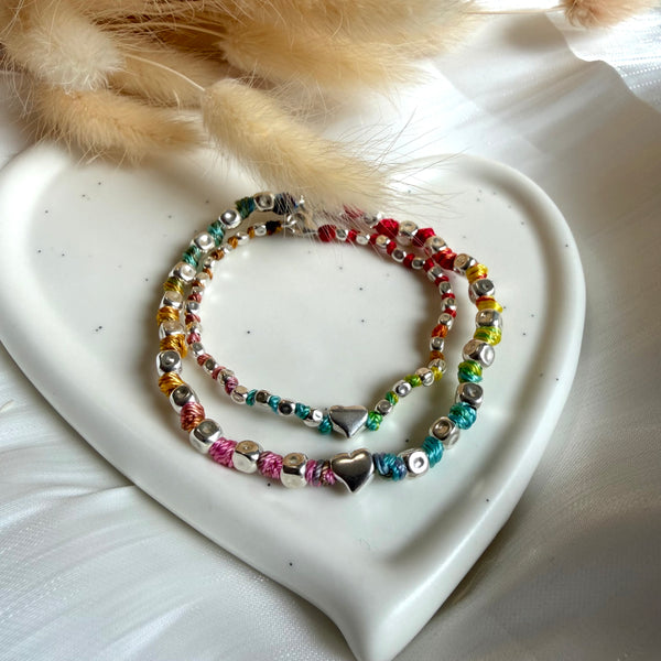 B067 Mother and daughter bracelet with hammered nuggets and central heart interspersed with knots