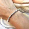 B0174 Bracciale palline martellate (possibilità di scegliere uno o più ciondoli e passanti da inserire)