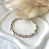 B0168 Bracciale palline piccole con cuori passanti rosati