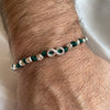 B0248 Bracciale filo nautico con pepite martellate e simbolo infinito.