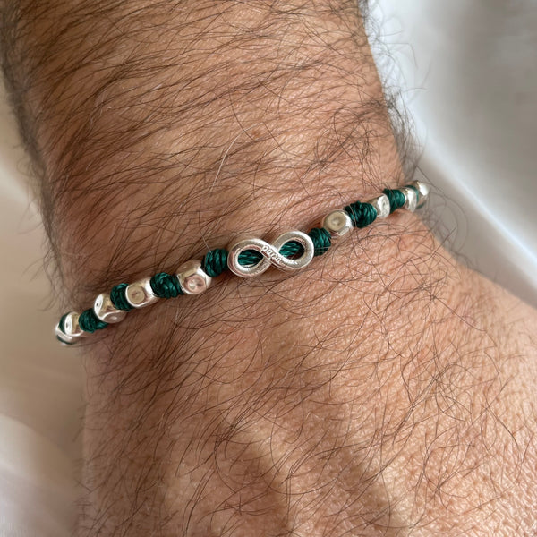 B0248 Bracciale filo nautico con pepite martellate e simbolo infinito.