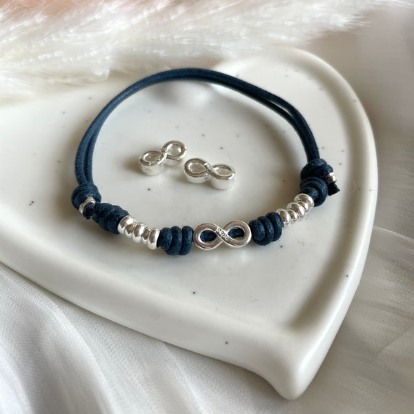 B0246 Bracciale in cordino cerato con simbolo infinto e rondelle
