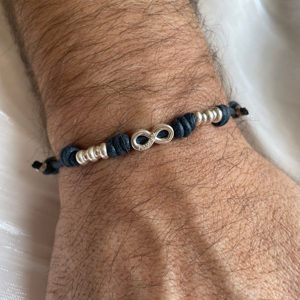 B0246 Bracciale in cordino cerato con simbolo infinto e rondelle
