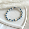 B0276 Bracciale con nodi, palline martellate e puzzle passante
