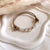 B0299 Bracciale in cordino cerato di coppia con puzzle, iniziali cubo e granelli