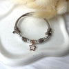 B169 Bracciale con cordino cerato, rondelle + ciondolo al centro (a scelta)