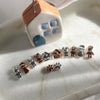 B0200 Bracciale con elementi passanti bimbi e casina Family, cordino cerato e granelli