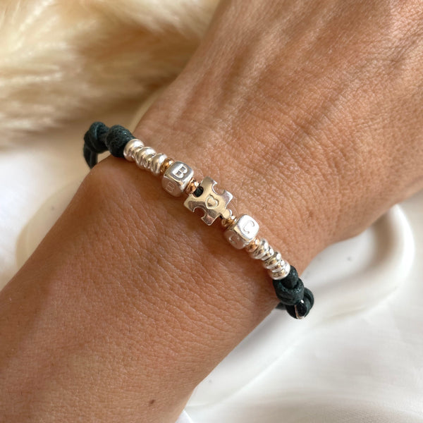 B0242 Bracciale in cordino cerato di coppia con puzzle, iniziali cubo e rondelle