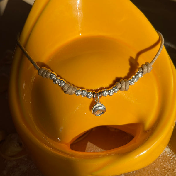 CL031 Necklace with waxed cord and tortellino pendant