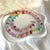 CL0185 Collana con rondelle candy arcobaleno, palline e rondelle argento