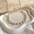 CL117 Collana rosario in argento con perle di fiume tonde.