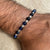 B006 Bracciale con palline occhio di tigre blu e granelli