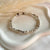 B0304 Bracciale con rondelle irregolari piccole e grandi e mix di pepite