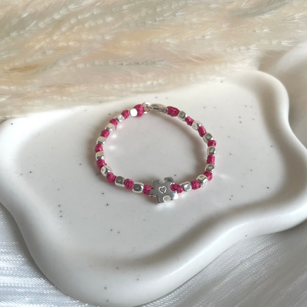 B0306 Bracciale baby con nodi, pepite piccole e puzzle passante