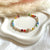 B0293 Bracciale in argento con pepite, cristalli multicolore, perle e volendo conchiglia naturale (inclusa nel prezzo)