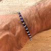 B092 Bracciale occhio di tigre blu intervallato da nodini intreccio