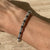 B084 Bracciale con rondelle ematite intervallate a rondelle piccole e medie