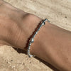 B054 Bracciale con palline martellate e rondelle con stelle bombate