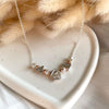 CL124 Collana rolò in argento con iniziali e casina Family passante